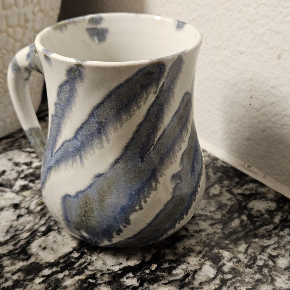 Studio pottery drip glazed‎ mug with artist signature on the bottom
